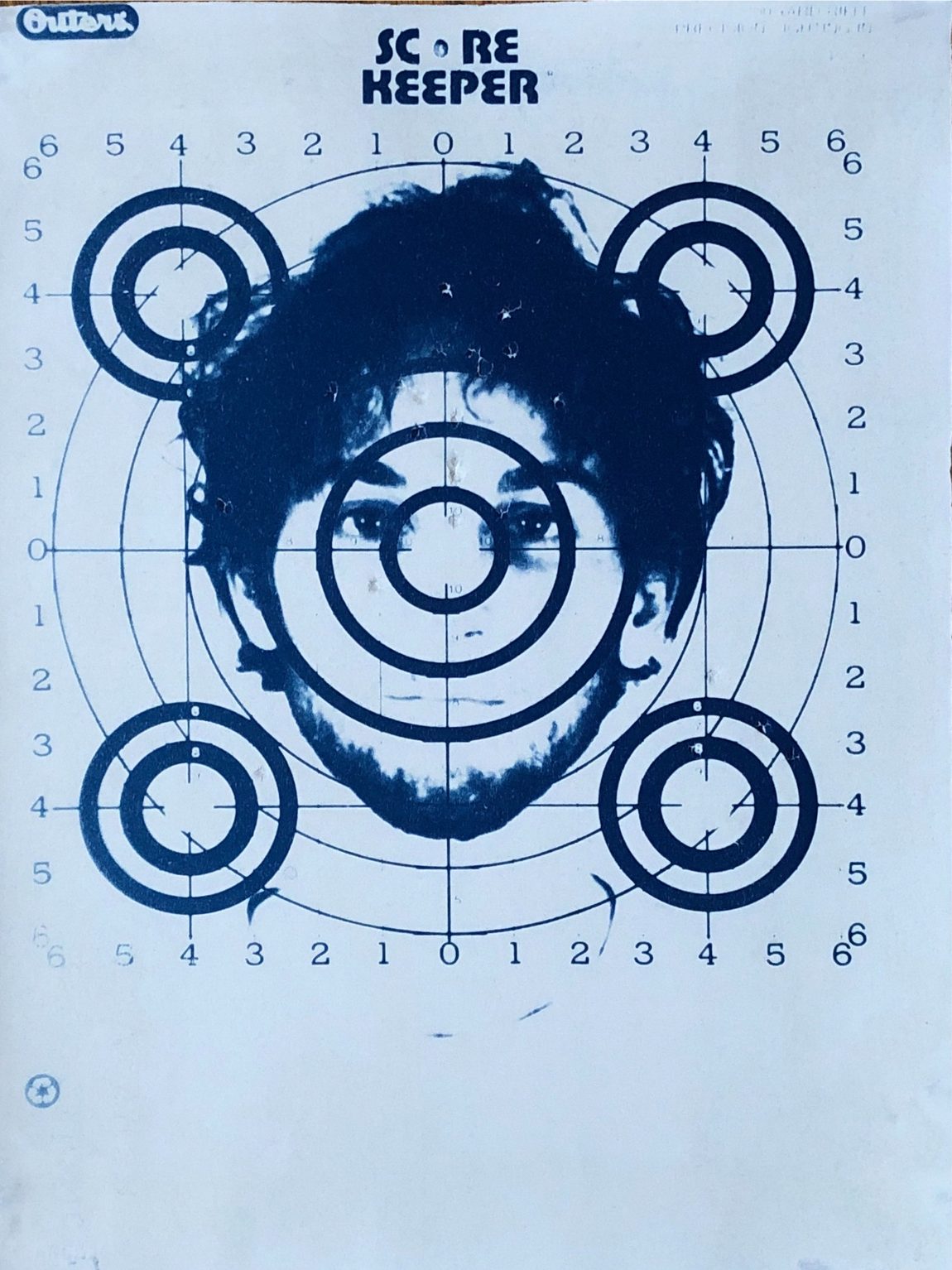 Cyanotype: snarling portrait over an oval target