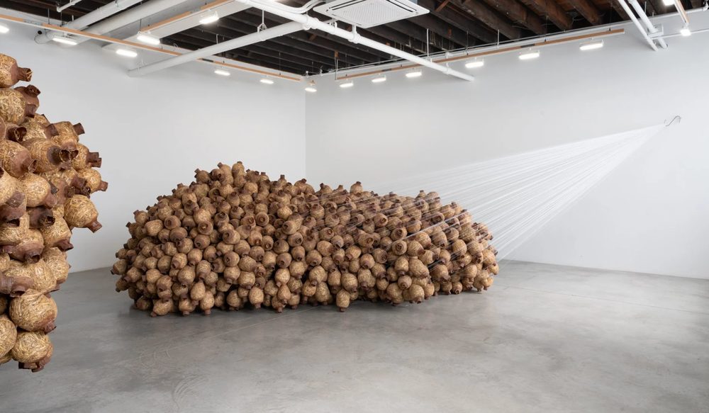 Wider view of the installation across the gallery floor
