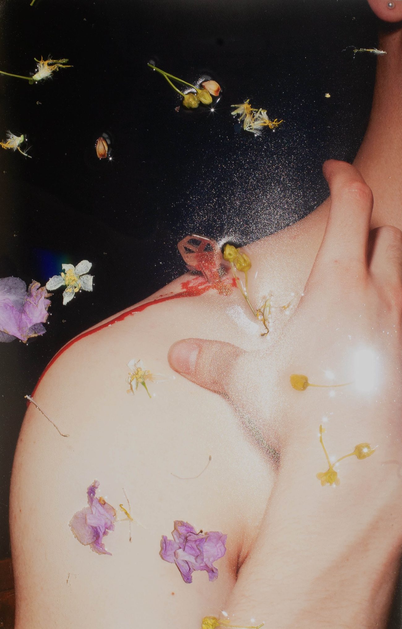 Shoulder and neck scattered with pressed flowers