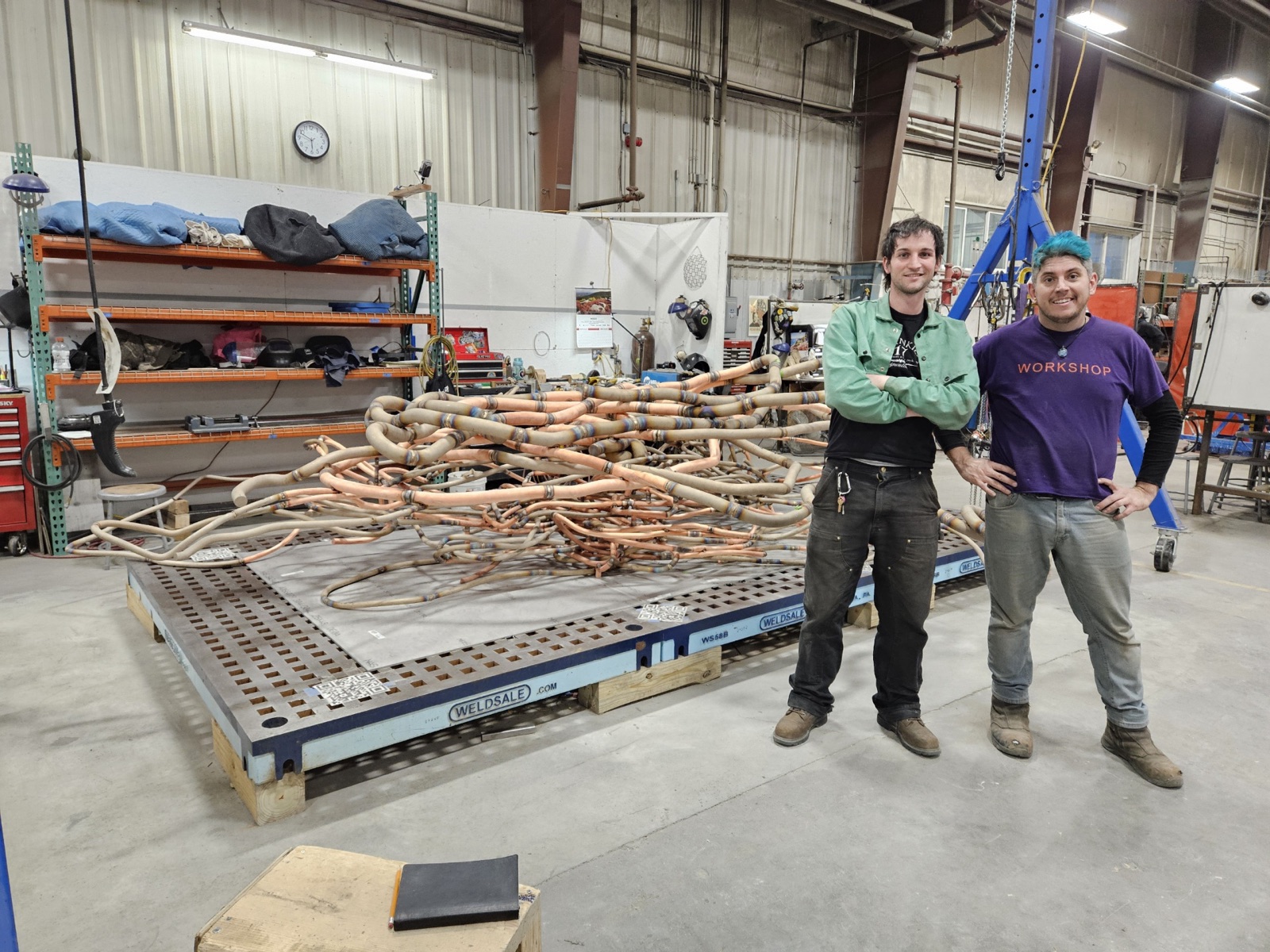 Fabricators working on a section of the sculpture